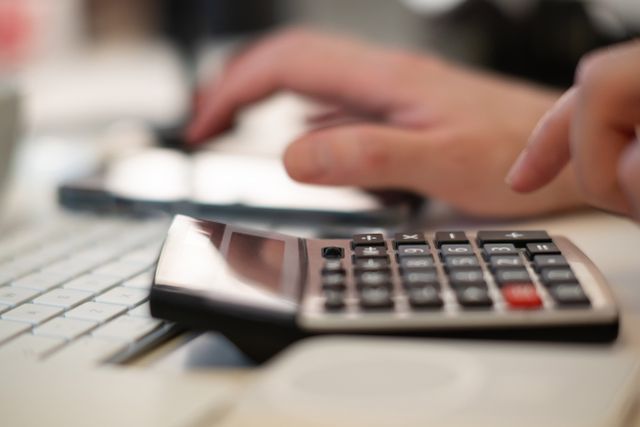 a%20person%20using%20a%20calculator